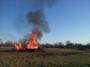 We dozed and burned for days to clean up the pastures. There were a dozen of these piles burning at once. You can see me next to these 25' flames!